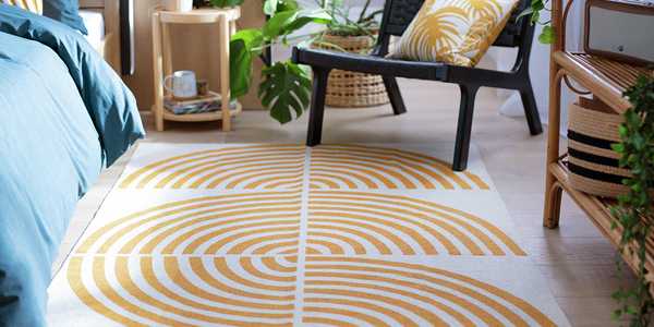 Yellow and white geo themed rug in the bedroom.